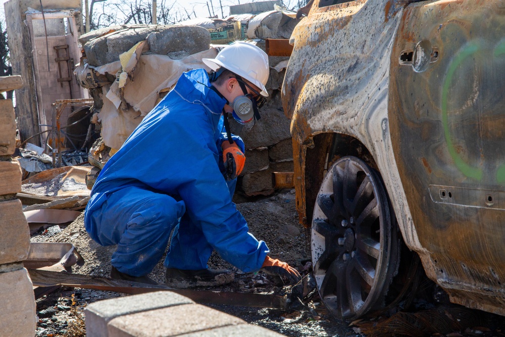 Soldier from 172nd Chemical Company Sifts through Debris