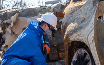 Soldier from 172nd Chemical Company Sifts through Debris