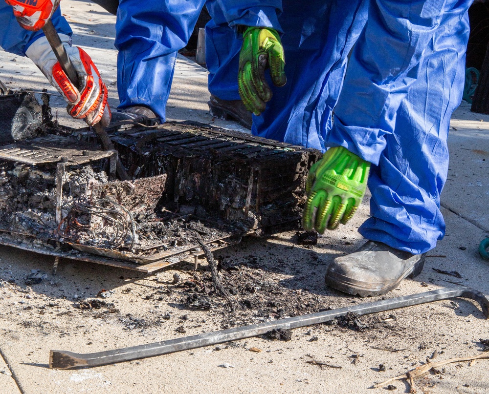 Airmen Disassemble Hazardous Lithium-ion Batteries