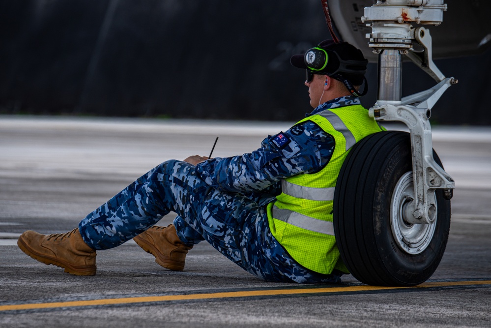 Trilateral partners come together on the flight line at Andersen AFB for CN25