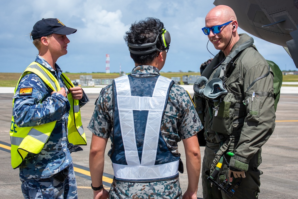 Trilateral partners come together on the flight line at Andersen AFB for CN25