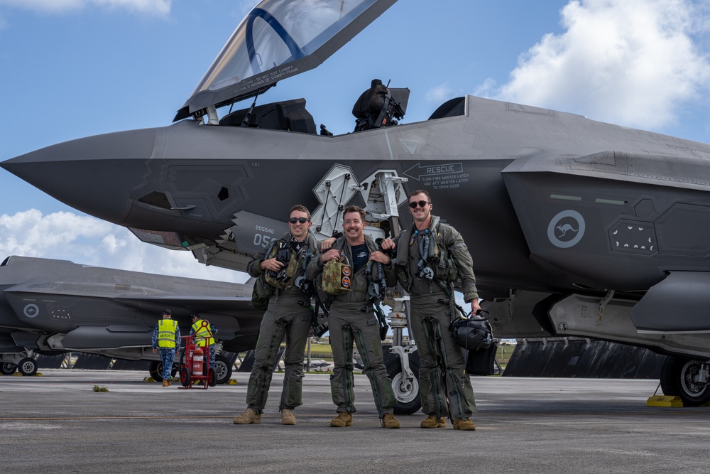 Trilateral partners come together on the flight line at Andersen AFB for CN25