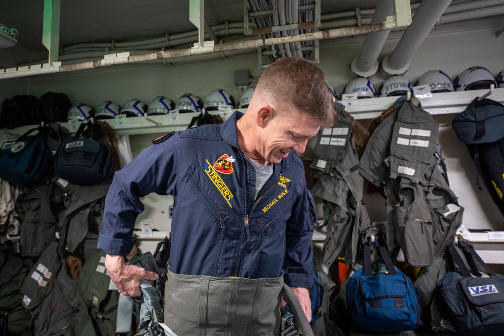 Rear Adm. Michael Wosje, commander of Carrier Strike Group ONE, completes his 1,000th trap flight aboard Nimitz-class aircraft carrier USS Carl Vinson (CVN 70)