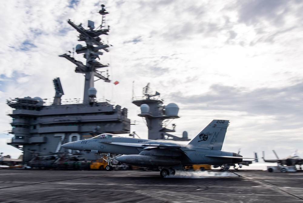 Rear Adm. Michael Wosje, commander of Carrier Strike Group ONE, completes his 1,000th trap flight aboard Nimitz-class aircraft carrier USS Carl Vinson (CVN 70)