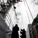 USS Emory S. Land (AS 39) departs Singapore