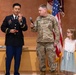Two Soldiers are promoted during a ceremony at WRAIR