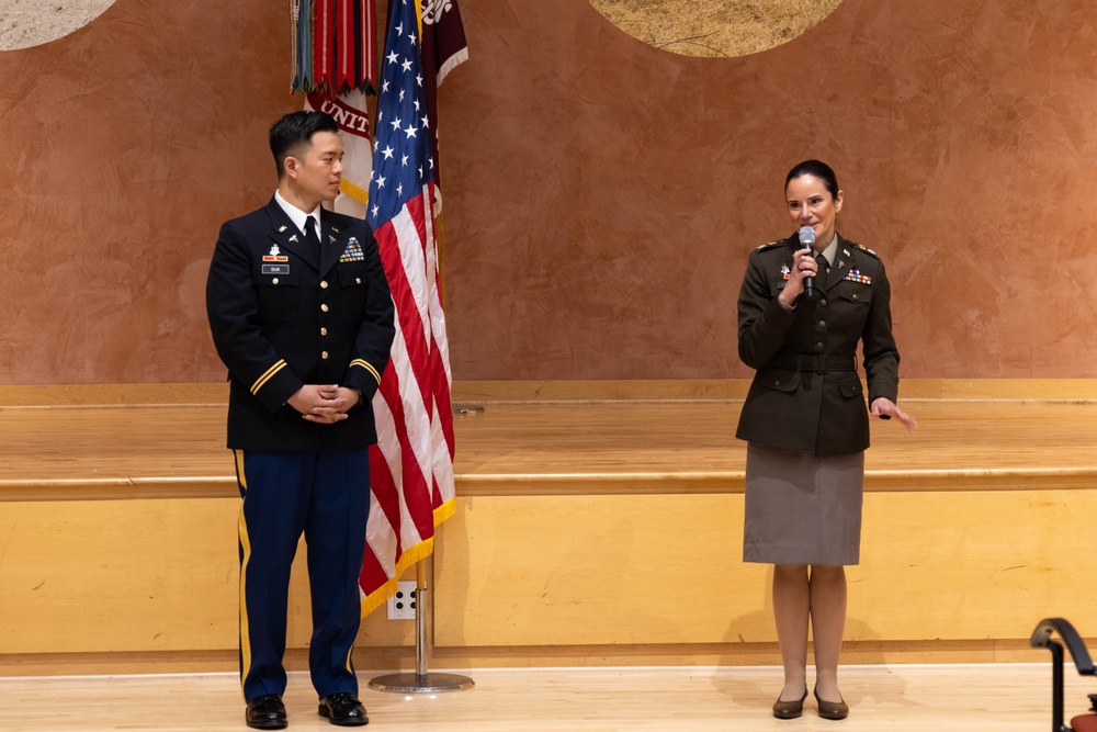 Two Soldiers are promoted during a ceremony at WRAIR