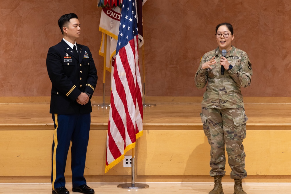 Two Soldiers are promoted during a ceremony at WRAIR