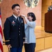 Two Soldiers are promoted during a ceremony at WRAIR