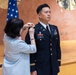 Two Soldiers are promoted during a ceremony at WRAIR