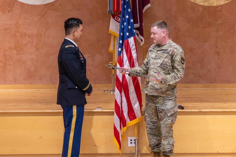 Two Soldiers are promoted during a ceremony at WRAIR