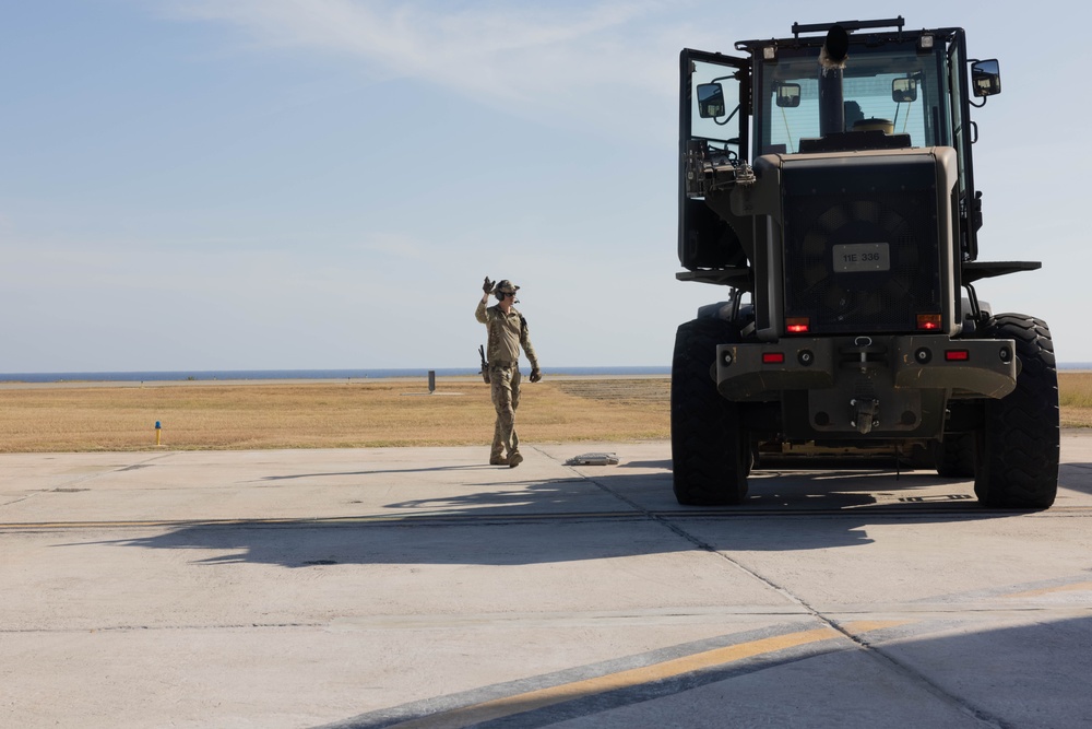 U.S. Service Members unload supplies in support of Joint Operation Southern Guard