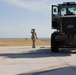 U.S. Service Members unload supplies in support of Joint Operation Southern Guard