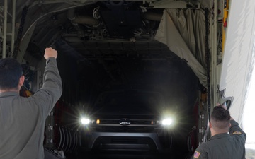 U.S. Service Members unload supplies in support of Joint Operation Southern Guard