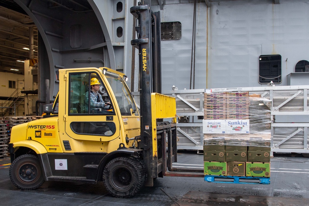 USS Ronald Reagan (CVN 76) Sailors receive fresh produce