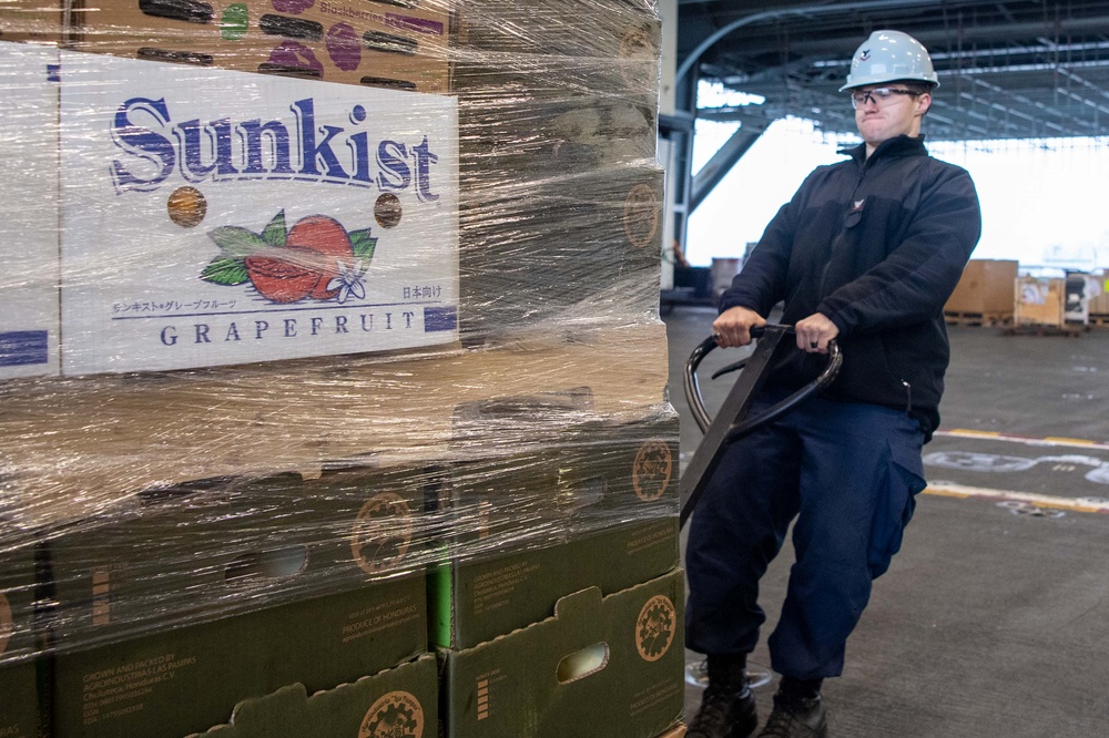 USS Ronald Reagan (CVN 76) Sailors receive fresh produce