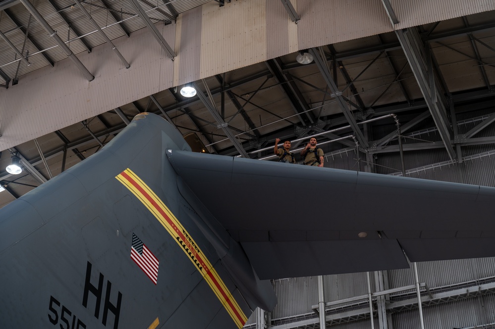 15th Maintenance Squadron performs routine maintenance on a C-17 Globemaster III