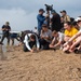 U.S. Navy Sailors release baby sea turtles into ocean during Multilateral Naval Exercise Komodo 2025 community relations project