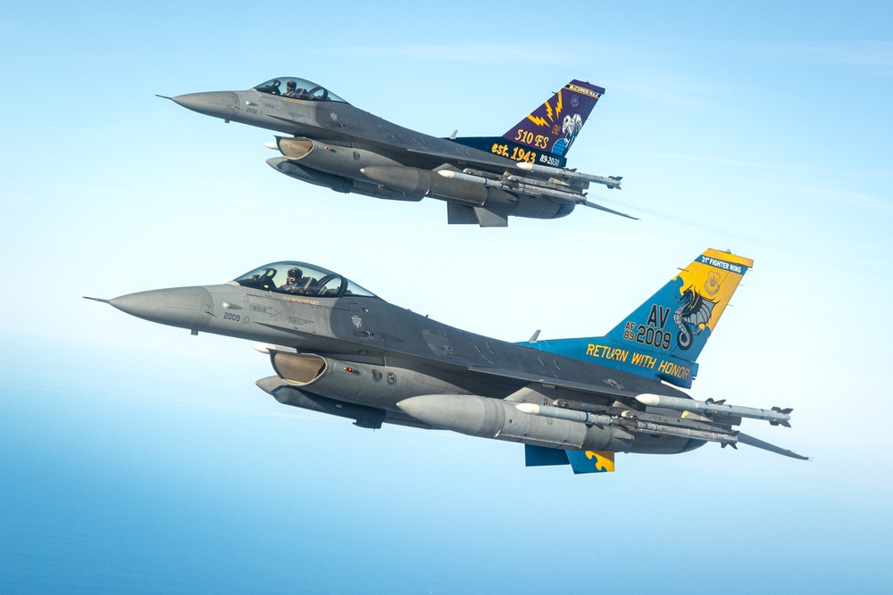 F-16s soar through the sky
