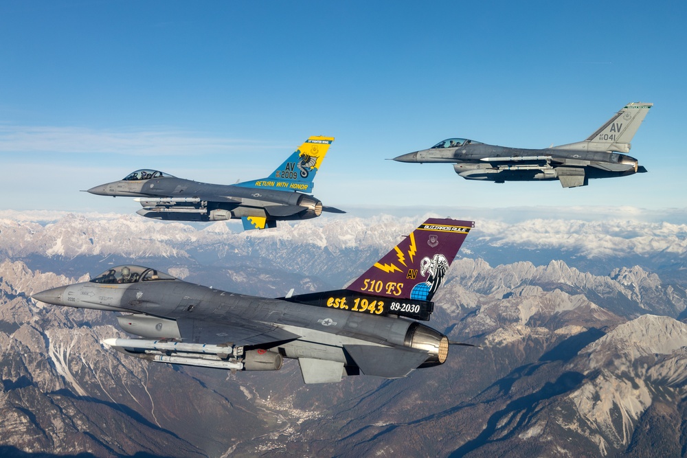 F-16s soar through the sky