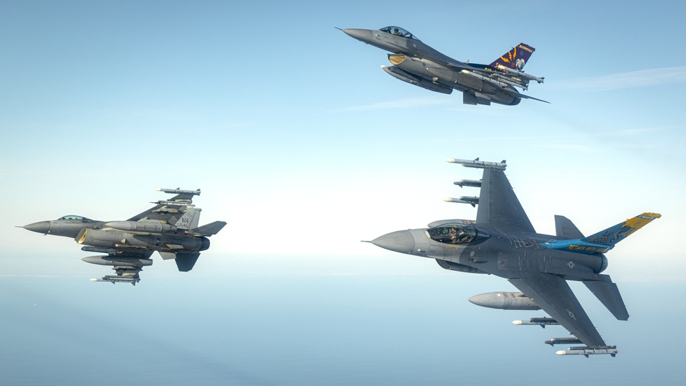 F-16s soar through the sky