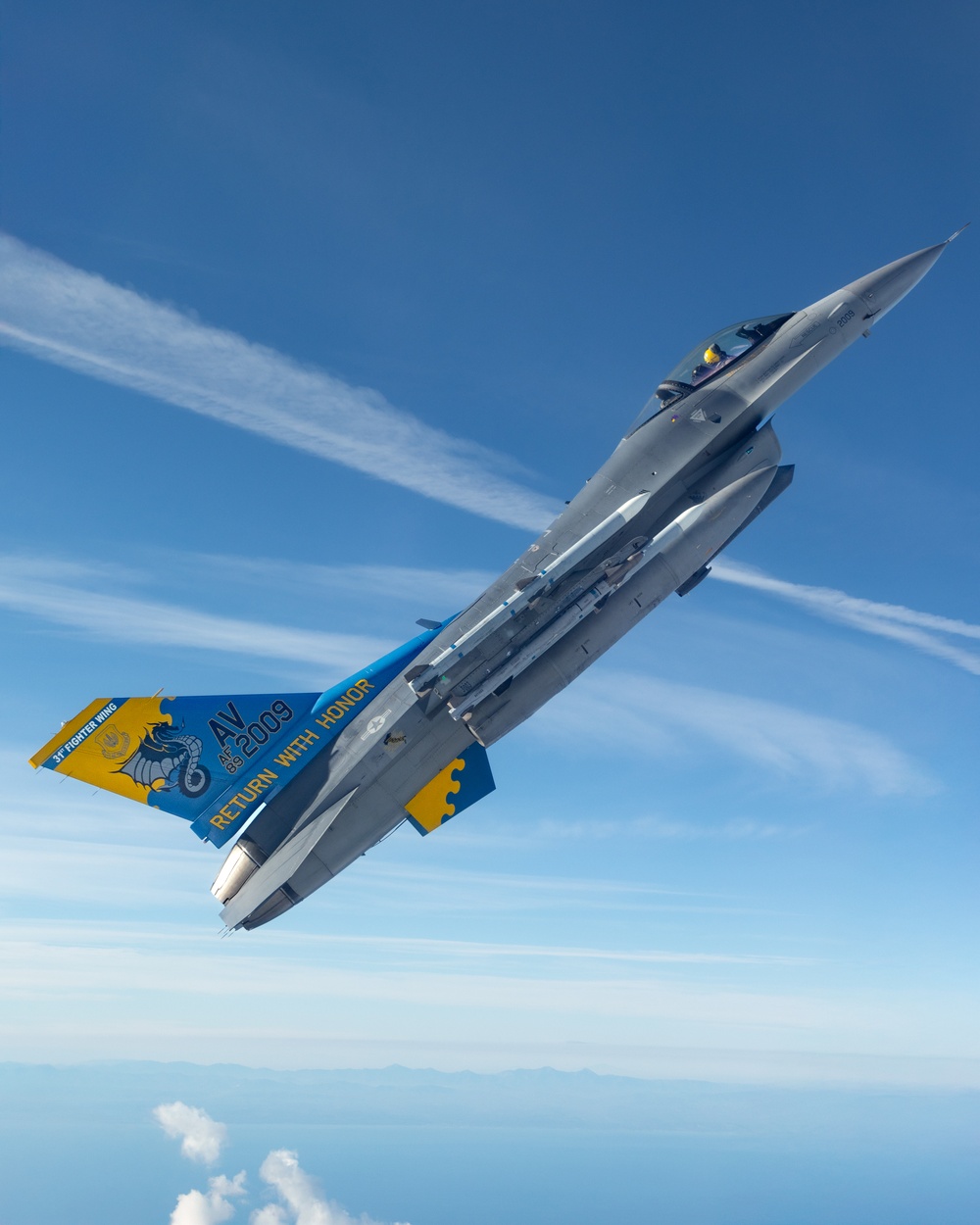 F-16s soar through the sky