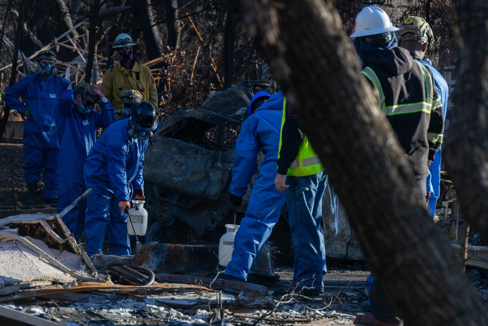 Day 5: U.S. service members dispose of burned batteries.