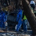 Day 5: U.S. service members dispose of burned batteries.