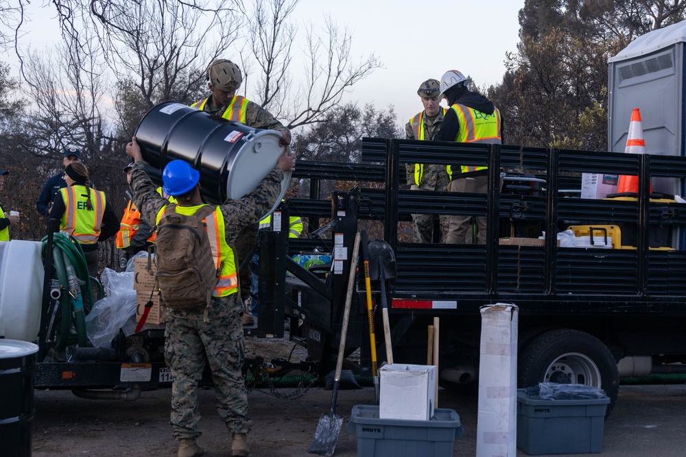 Day 5: U.S. service members dispose of burned batteries.