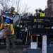 Day 5: U.S. service members dispose of burned batteries.