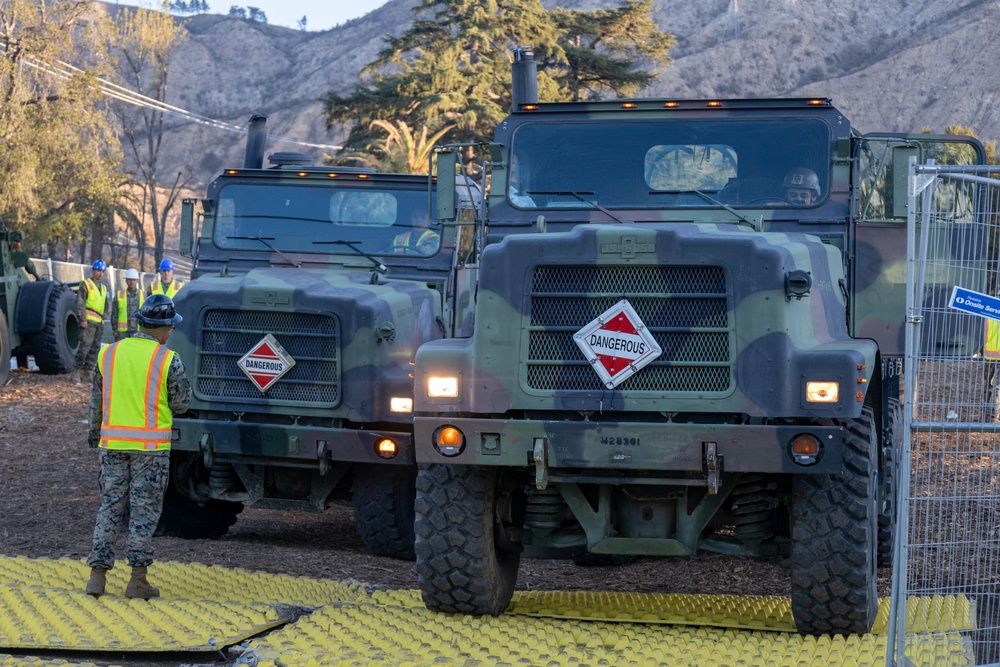 Day 5: U.S. service members dispose of burned batteries.