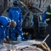 Day 5: U.S. service members dispose of burned batteries.