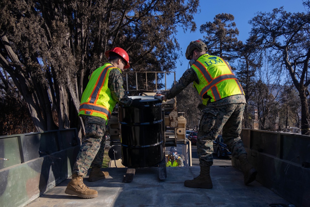 Day 5: U.S. service members dispose of burned batteries.