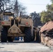 Day 5: U.S. service members dispose of burned batteries.