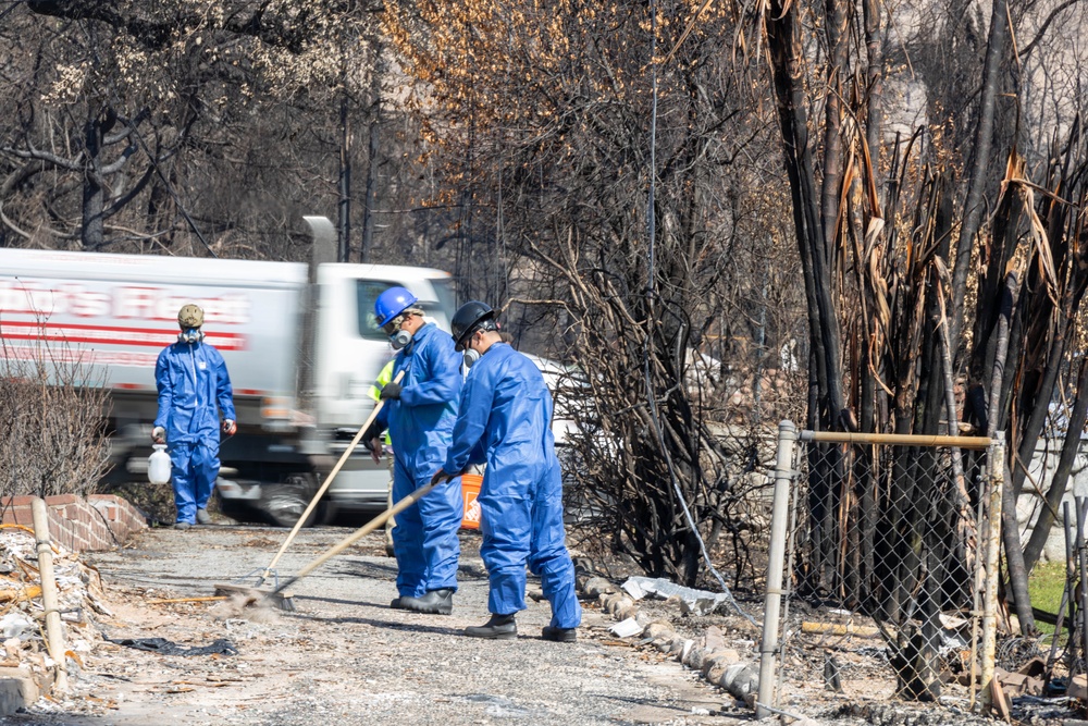 Day 5: U.S. service members dispose of burned batteries.