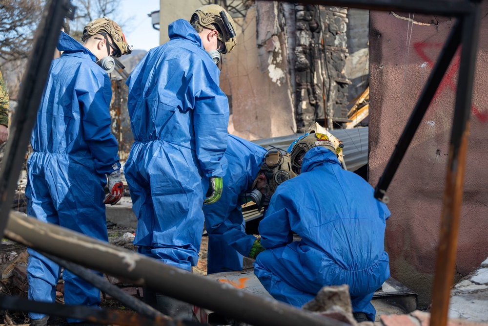 U.S. service members dispose of power walls