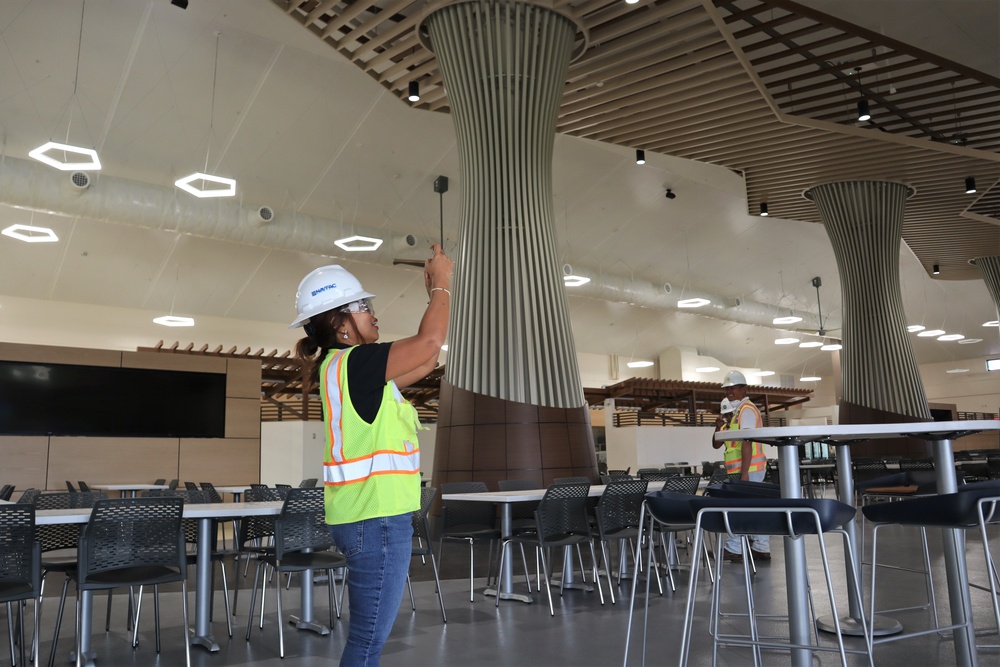 The Construction Manager Documents Punch List Items During a Final Walk Through of the New Dining Facility