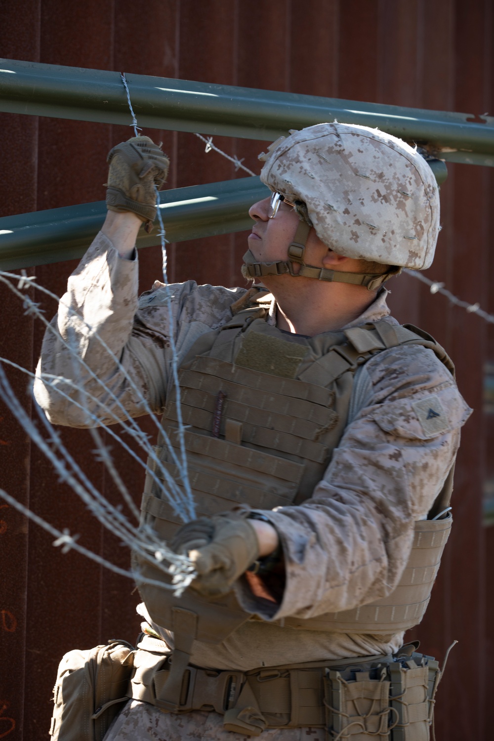 U.S. Marines mount concertina wire along southern border wall