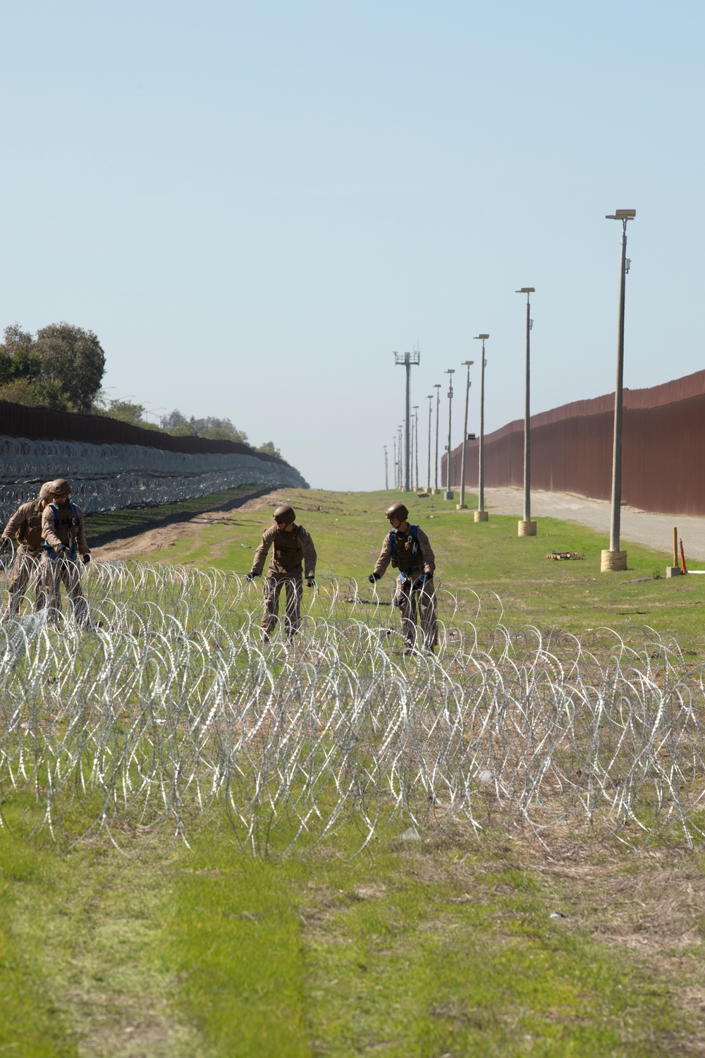 U.S. Marines mount concertina wire along southern border wall