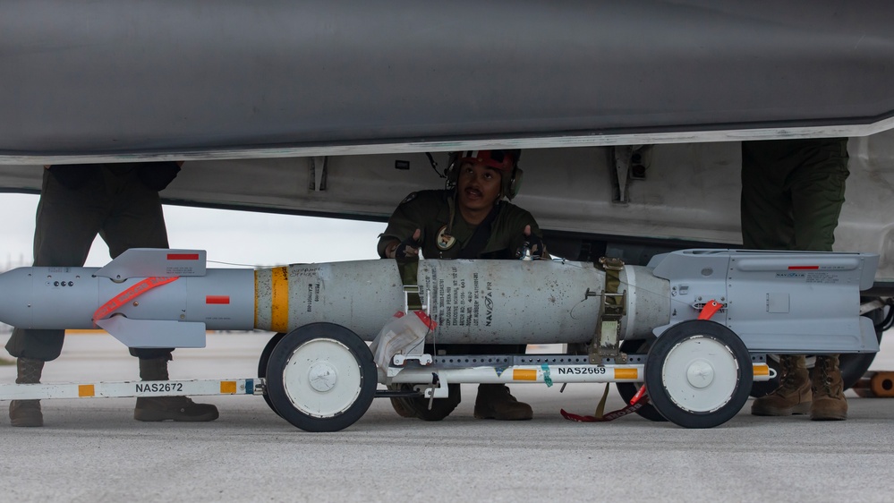 U.S. Marines load F-35B weaponry during Cope North 25