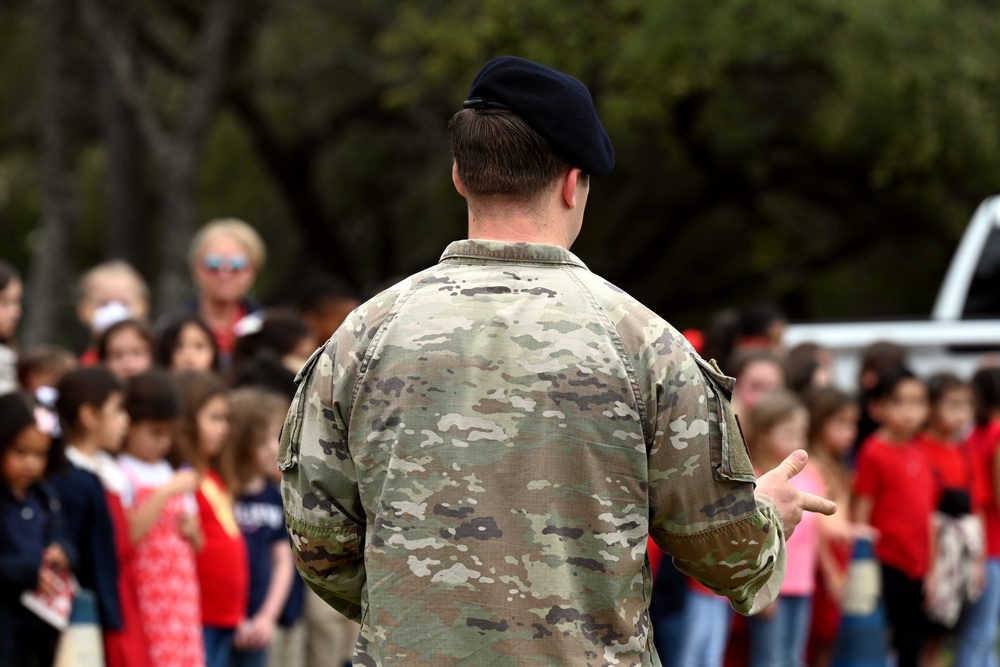 902nd Security Forces Squadron military working dog team visits local school