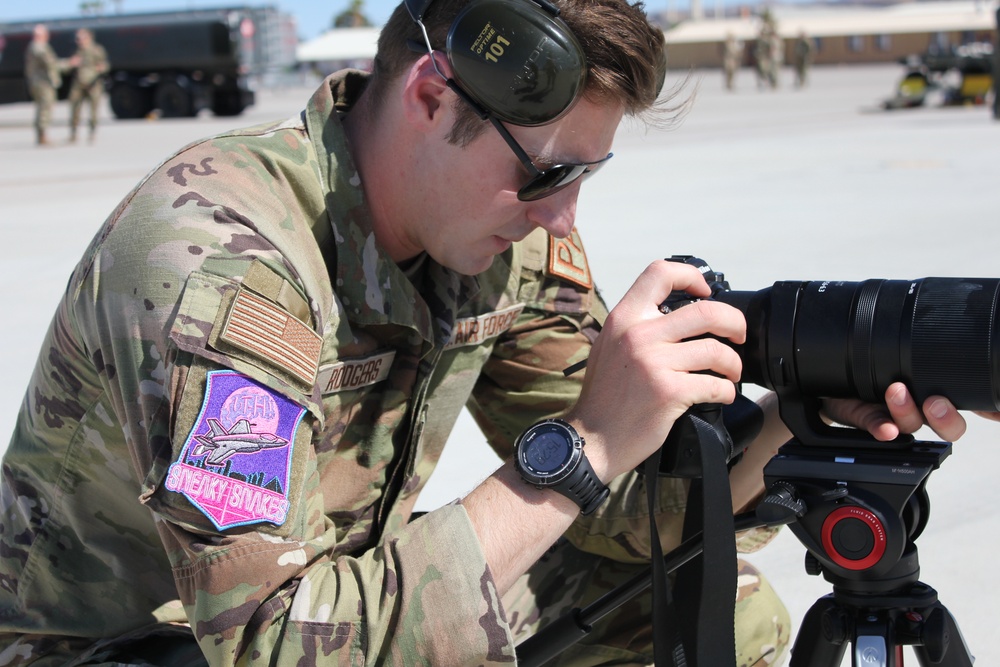 Public Affairs Sr. Airman Jack Rogers captures images of annual training