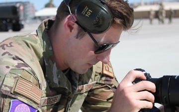 Public Affairs Sr. Airman Jack Rogers captures images of annual training