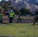 Day 7: U.S. service members dispose of burned batteries