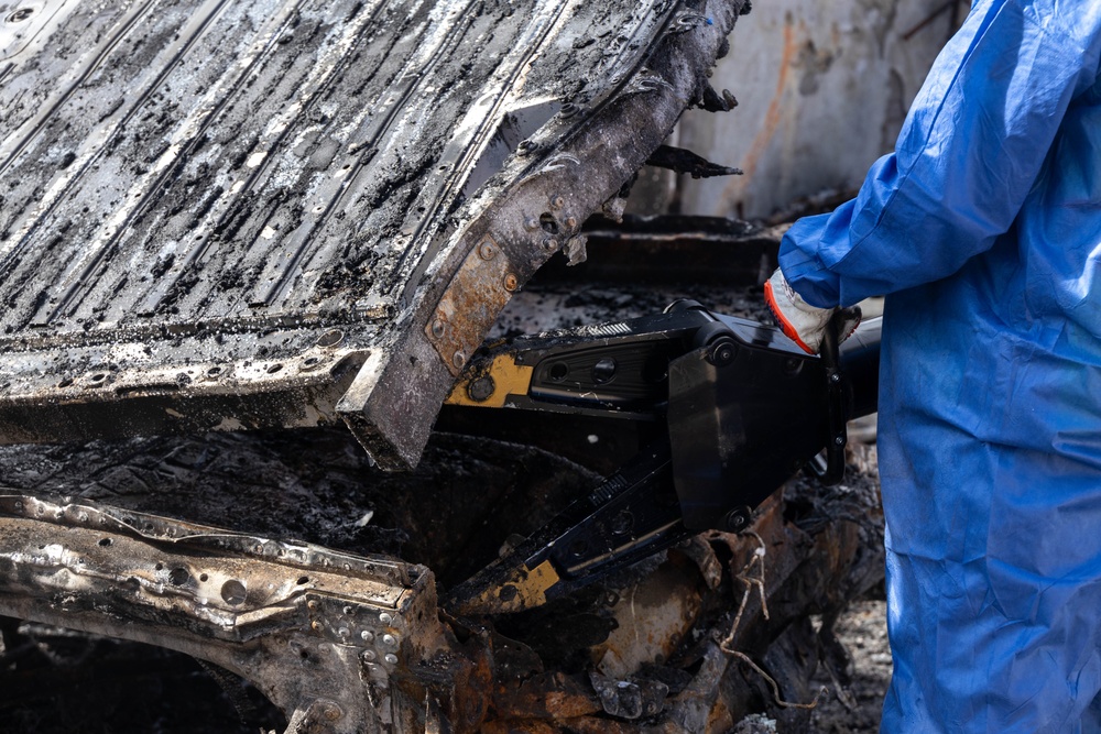 Day 7: U.S. service members dispose of burned batteries