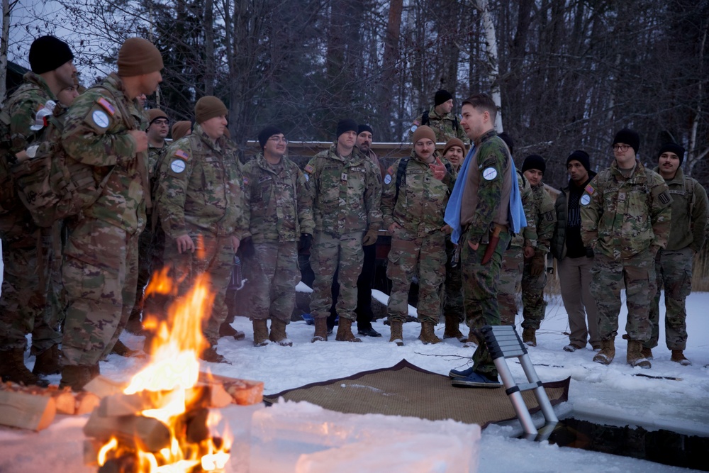 Virginia National Guard Soldiers participate in Finnish past-time of “avanto” or ice-hole swimming during Arctic Forge 25