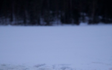 Virginia National Guard Soldiers participate in Finnish past-time of “avanto” or ice-hole swimming during Arctic Forge 25