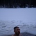 Virginia National Guard Soldiers participate in Finnish past-time of “avanto” or ice-hole swimming during Arctic Forge 25