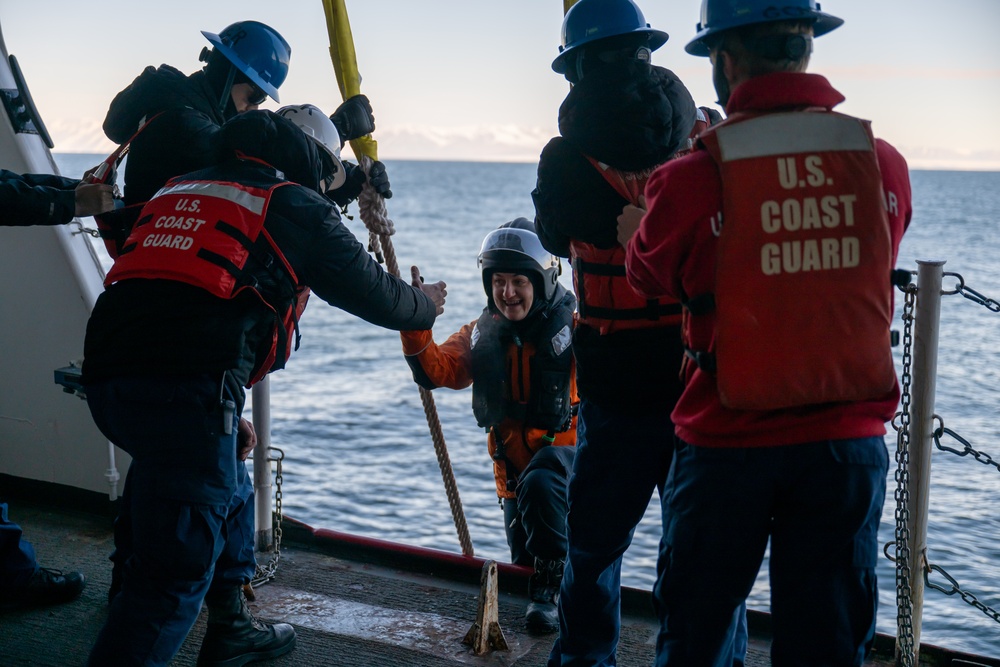 USCGC Polar Star (WAGB 10) conducts crew exchange in McMurdo Sound during Operation Deep Freeze