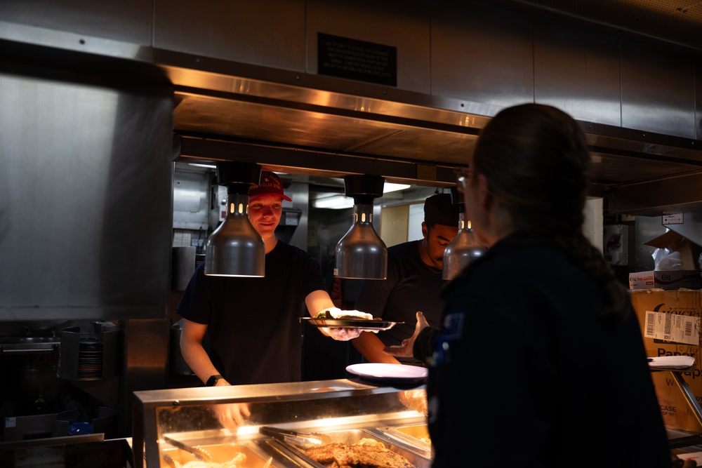 USCGC Polar Star (WAGB 10) conducts crew exchange in McMurdo Sound during Operation Deep Freeze